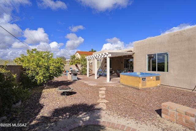 11219 N Platte Dr, Oro Valley, AZ 85737 - view of yard with a pergola, a hot tub, a fenced backyard, an outdoor fire pit, and a patio area