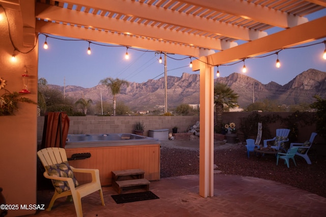 11219 N Platte Dr, Oro Valley, AZ 85737 - view of patio / terrace featuring a pergola, a fenced backyard, a mountain view, and a hot tub