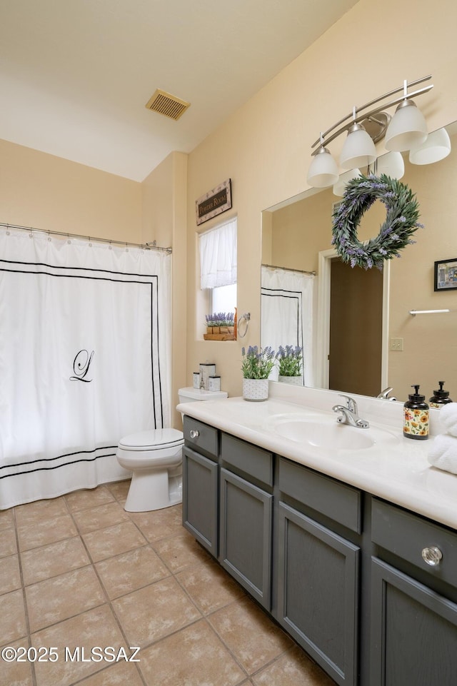 11219 N Platte Dr, Oro Valley, AZ 85737 - bathroom featuring visible vents, curtained shower, toilet, tile patterned floors, and vanity