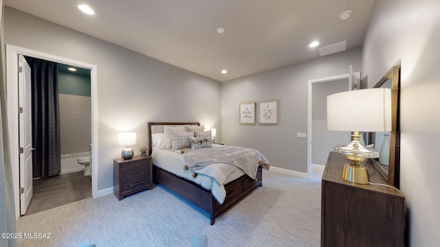 bedroom featuring recessed lighting, visible vents, light carpet, and baseboards