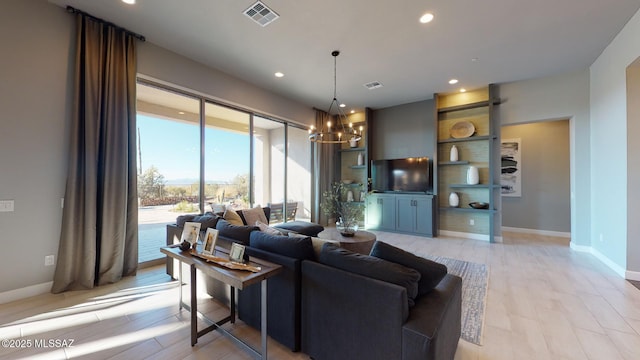 living room featuring a notable chandelier, visible vents, recessed lighting, and baseboards