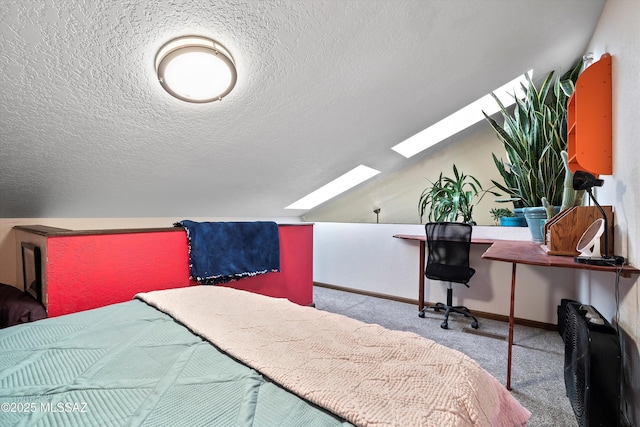 bedroom featuring baseboards, lofted ceiling with skylight, a textured ceiling, and carpet flooring