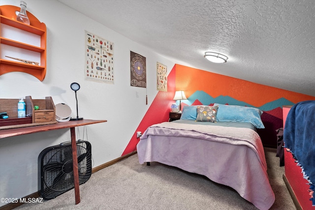 carpeted bedroom with a textured ceiling and baseboards