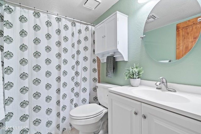 bathroom featuring visible vents, toilet, a shower with curtain, a textured wall, and vanity