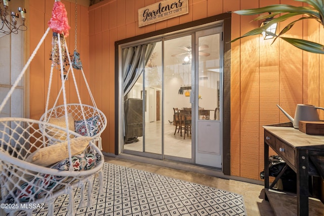 property entrance with a patio and outdoor dining space