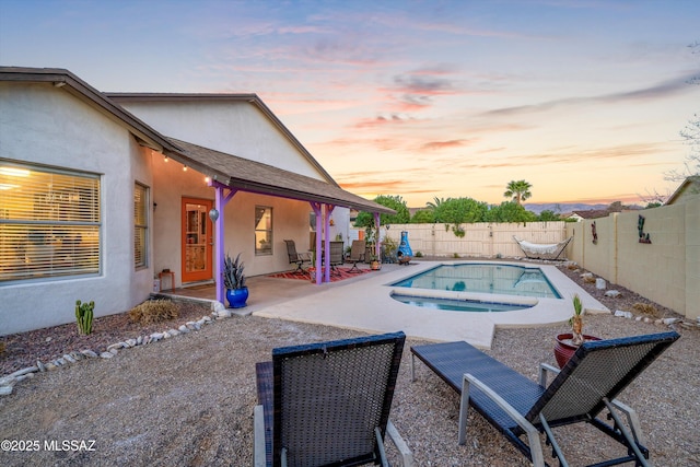 view of swimming pool with a patio area, a fenced in pool, an in ground hot tub, and a fenced backyard