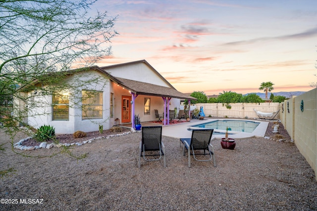 view of swimming pool with a fenced in pool, a fenced backyard, and a patio area