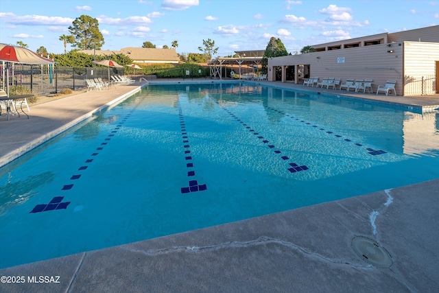 pool featuring a patio and fence