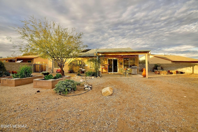 back of house featuring fence and a patio area