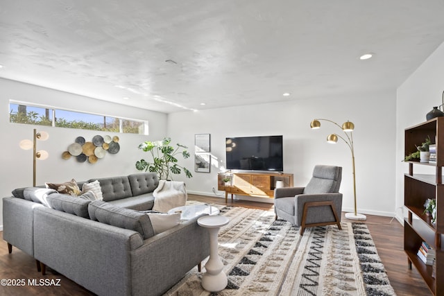 living area with wood finished floors, recessed lighting, and baseboards