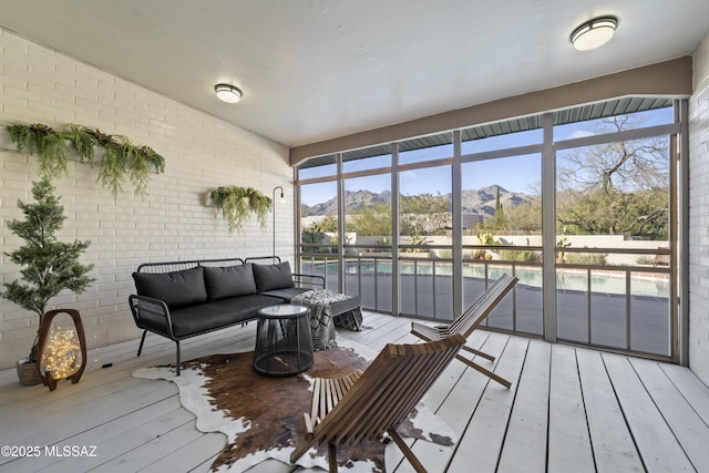 sunroom / solarium with a mountain view