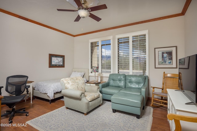 bedroom featuring ornamental molding, baseboards, a ceiling fan, and wood finished floors