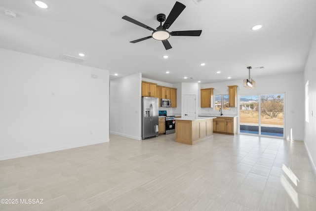 kitchen with visible vents, open floor plan, recessed lighting, stainless steel appliances, and light countertops