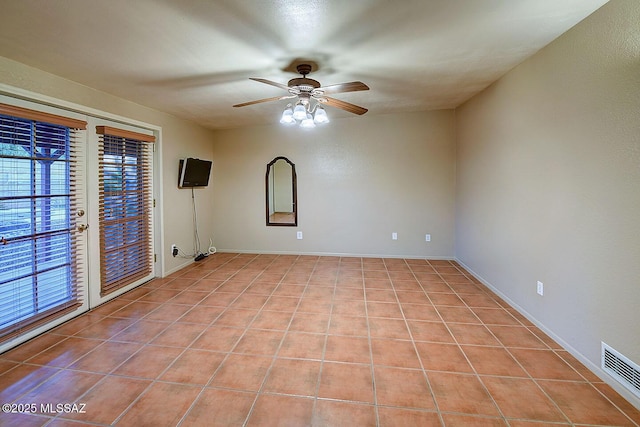 unfurnished room featuring visible vents, ceiling fan, and light tile patterned flooring