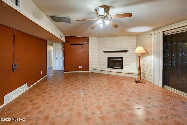 unfurnished living room with tile patterned flooring, a ceiling fan, and visible vents