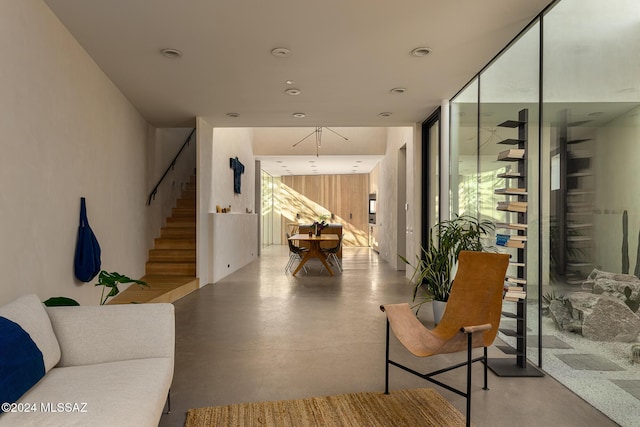 interior space featuring floor to ceiling windows and concrete floors