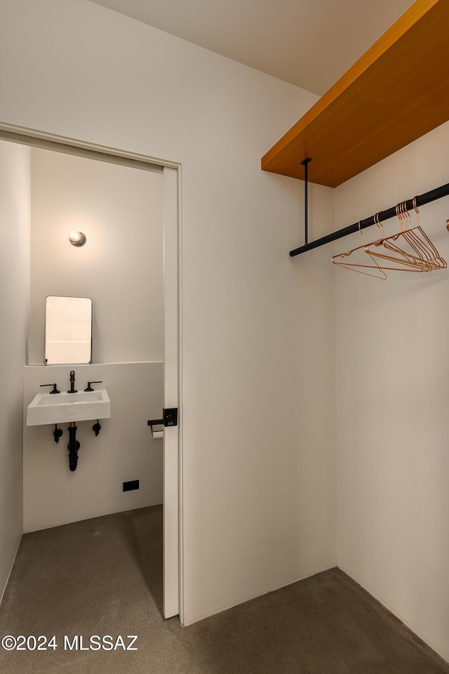 spacious closet featuring a sink