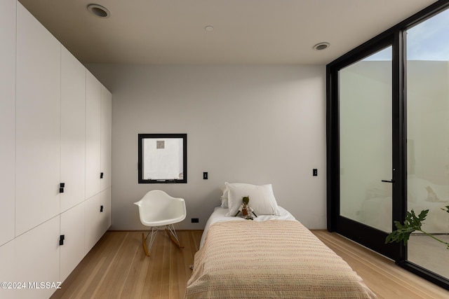 bedroom featuring light wood finished floors