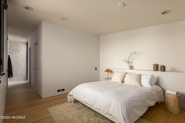 bedroom featuring light wood-style flooring