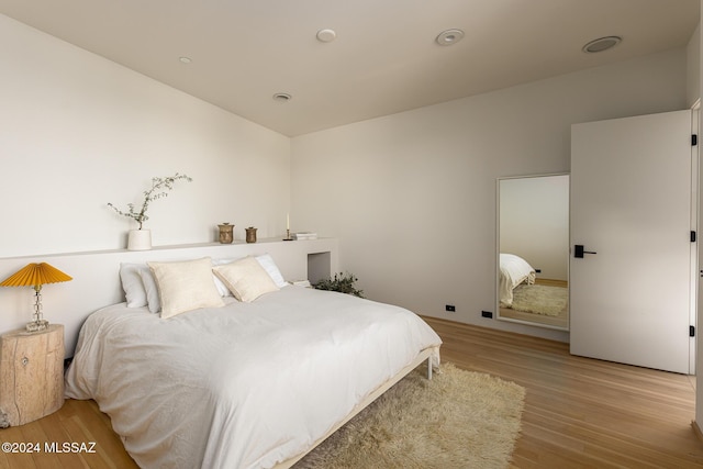 bedroom with light wood finished floors