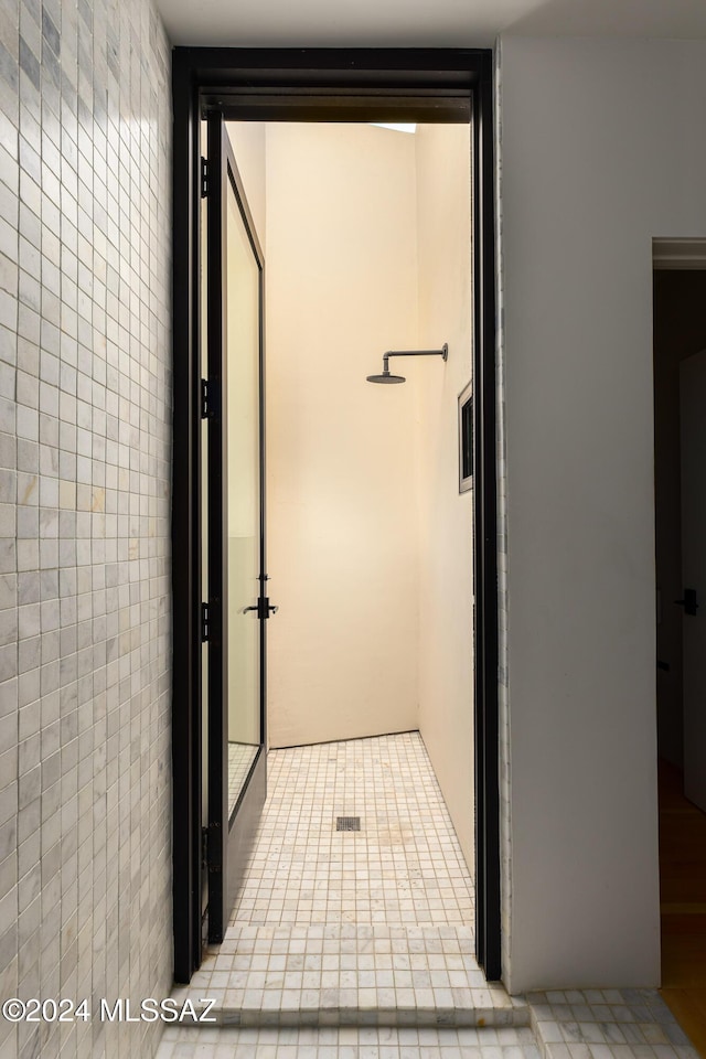 hallway with tile walls