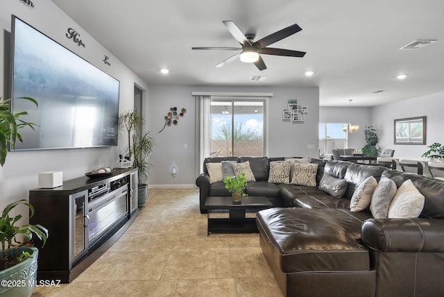 living area featuring recessed lighting, visible vents, and a healthy amount of sunlight