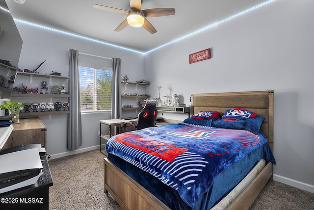 bedroom with a ceiling fan and baseboards