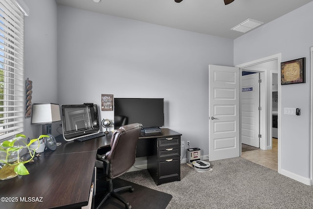 office with visible vents, baseboards, a ceiling fan, and carpet floors