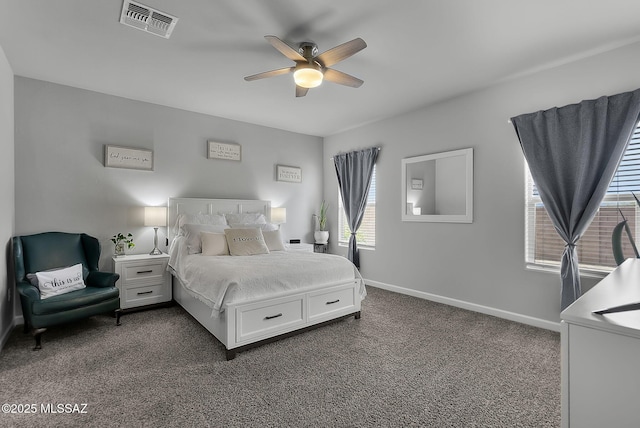 bedroom featuring baseboards, visible vents, dark carpet, and ceiling fan