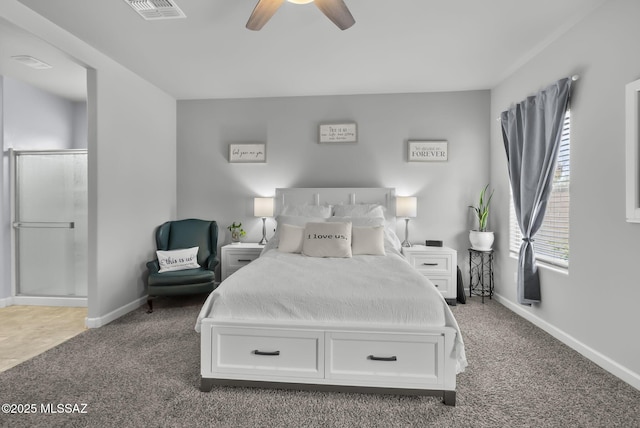 bedroom featuring visible vents, baseboards, ensuite bathroom, and carpet flooring