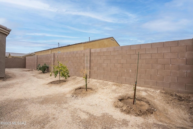 view of yard with a fenced backyard