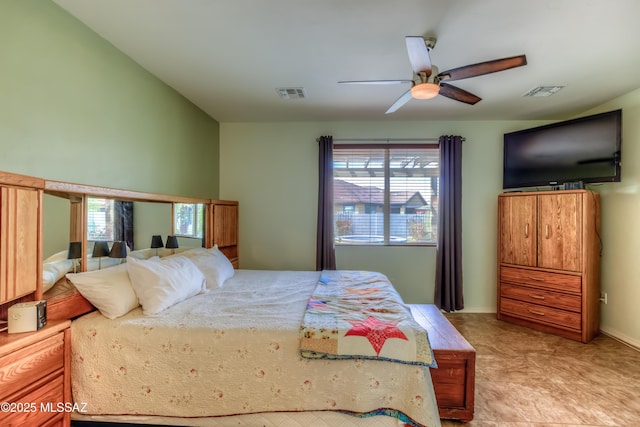 bedroom with visible vents, multiple windows, and a ceiling fan