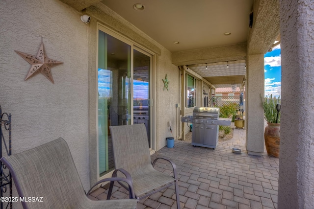 view of patio with a grill