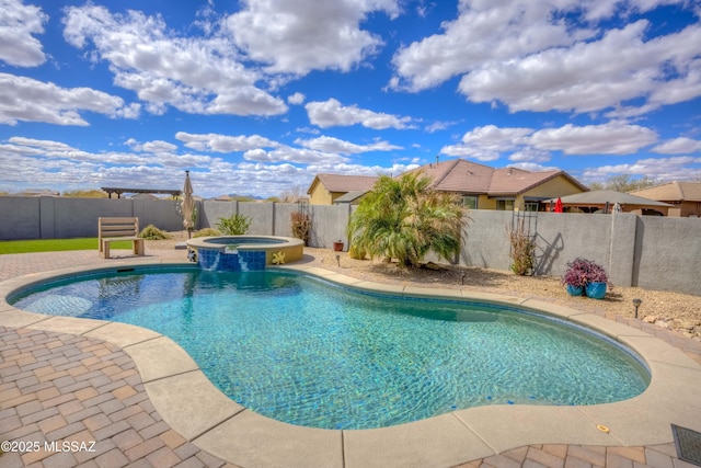 view of swimming pool with a patio, a pool with connected hot tub, and a fenced backyard