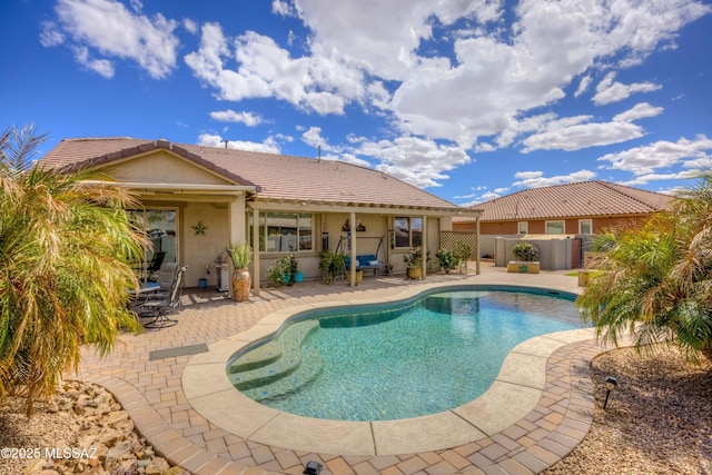 outdoor pool with a patio