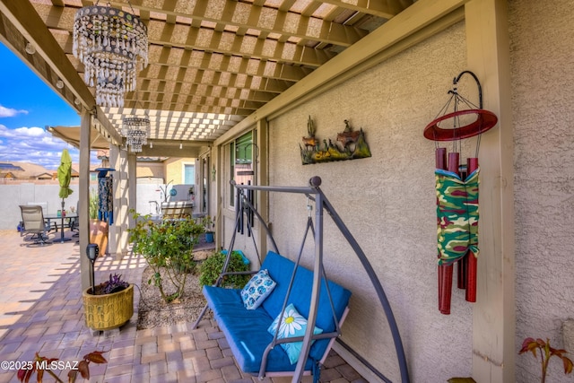 view of patio with fence and a pergola