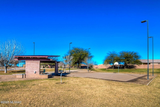 view of home's community featuring a yard and fence