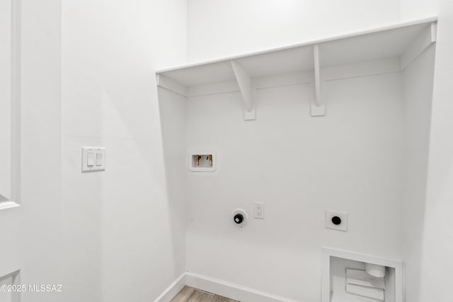 laundry room with baseboards, hookup for an electric dryer, laundry area, washer hookup, and light wood-type flooring