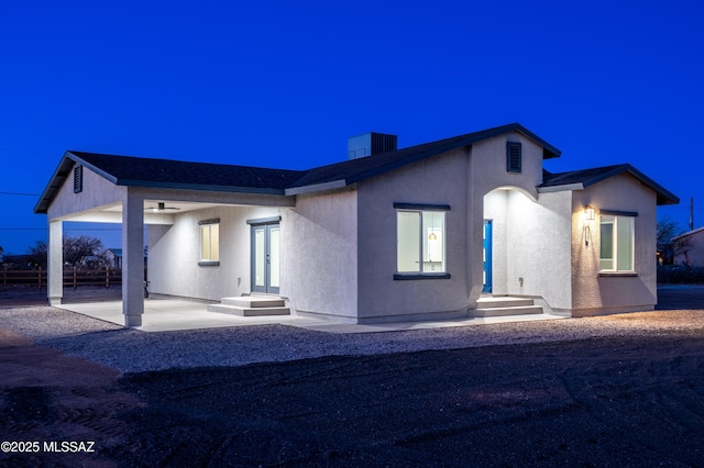 view of front facade featuring stucco siding