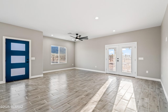 foyer featuring recessed lighting, french doors, baseboards, and light wood-style floors