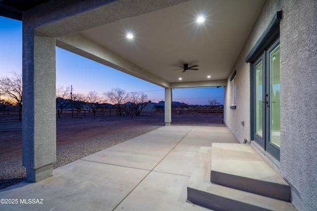 view of patio / terrace with a ceiling fan and fence