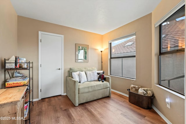 sitting room featuring wood finished floors and baseboards