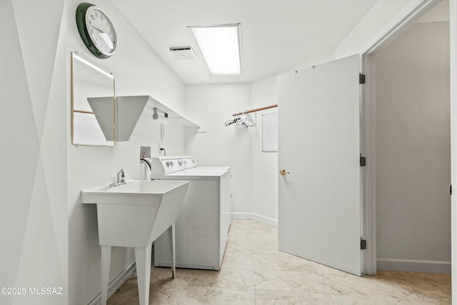 laundry area with visible vents, baseboards, washing machine and dryer, laundry area, and marble finish floor