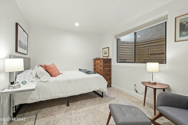 bedroom featuring recessed lighting and baseboards