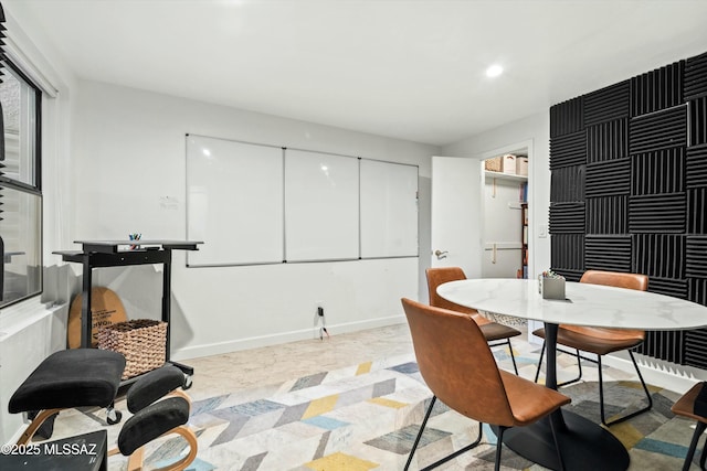 dining area featuring recessed lighting and baseboards