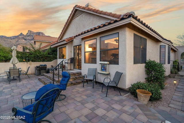 view of patio featuring outdoor dining space and a mountain view