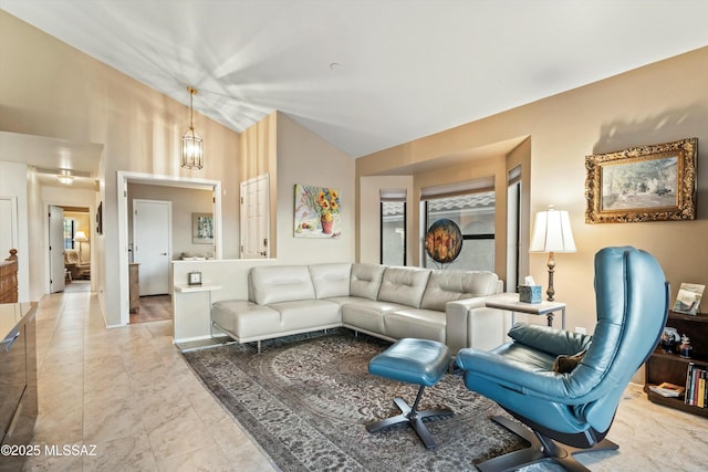 living room featuring vaulted ceiling