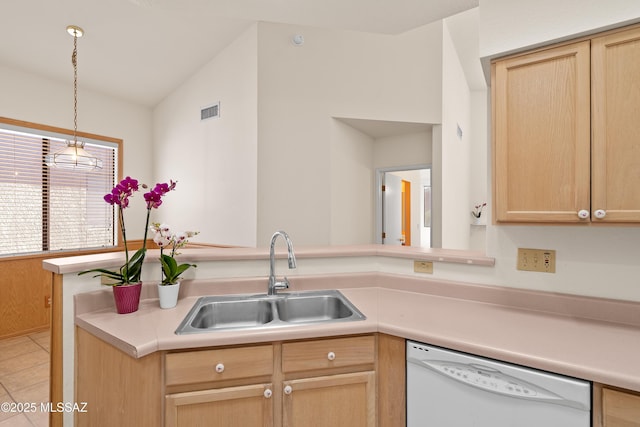 kitchen with visible vents, light brown cabinetry, a sink, white dishwasher, and light countertops