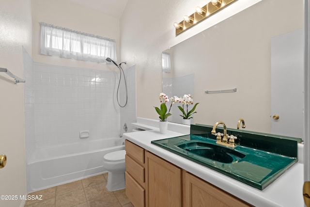 full bath with tile patterned flooring, bathing tub / shower combination, toilet, and vanity