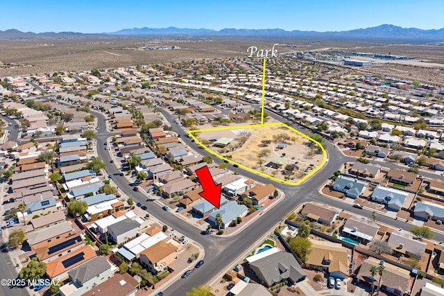 aerial view featuring a mountain view and a residential view